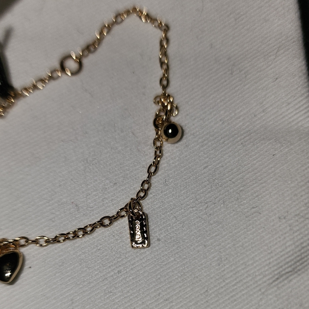 Coach Gold-Tone Delicate Charm Bracelet - Picture 6 of 7